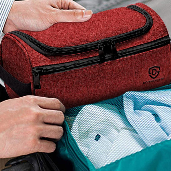 Red/Maroon colored, waterproof, hanging toiletry bag with inner and outer pockets.
